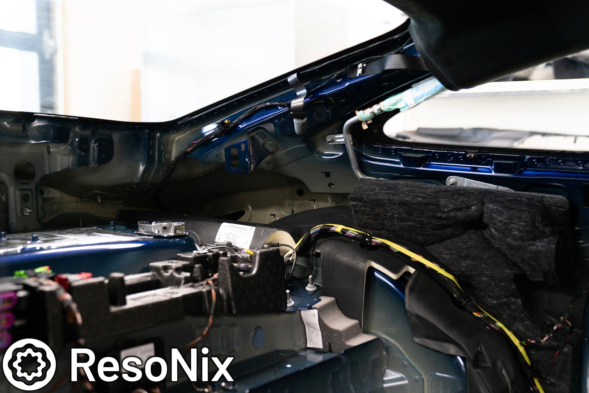 Rear interior of a 992 Porsche 911 GT3 Touring with trim panels removed in preparation of installing ResoNix Sound Solutions CLD Squares sound deadening material and Fiber Mat sound absorbing and thermal insulation material