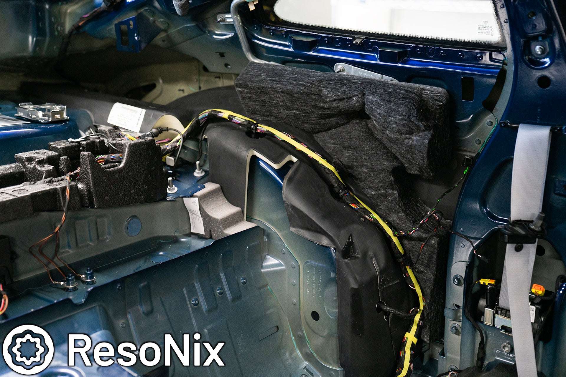 Rear interior of a 992 Porsche 911 GT3 Touring with trim panels removed in preparation of installing ResoNix Sound Solutions CLD Squares sound deadening material and Fiber Mat sound absorbing and thermal insulation material