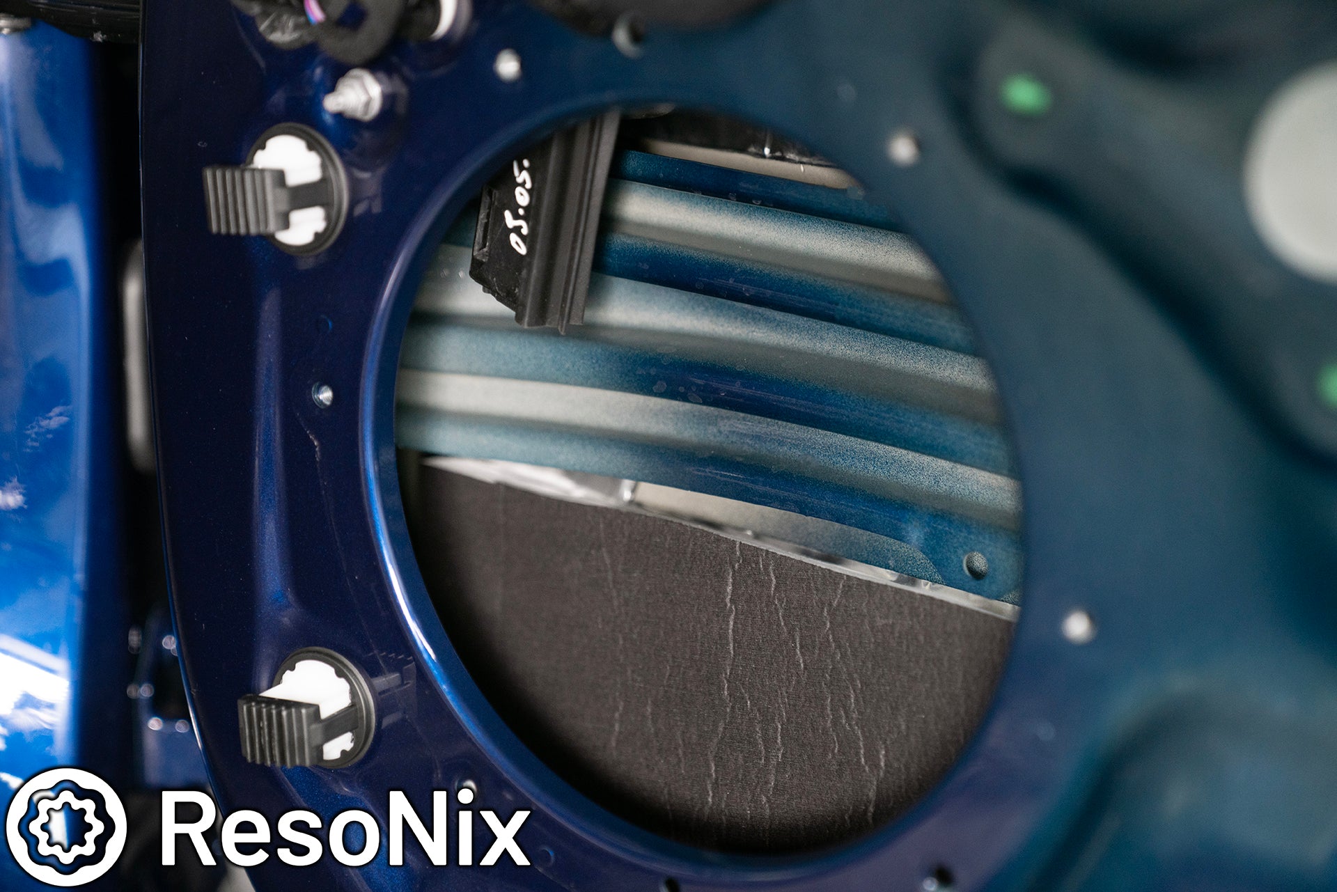 ResoNix Sound Solutions Guardian hydrophobic melamine and MLV door midbass rear wave sound absorber installed into the door of a Porsche 911 to reduce distortion from the audio system and reduce outside wind and tire noise