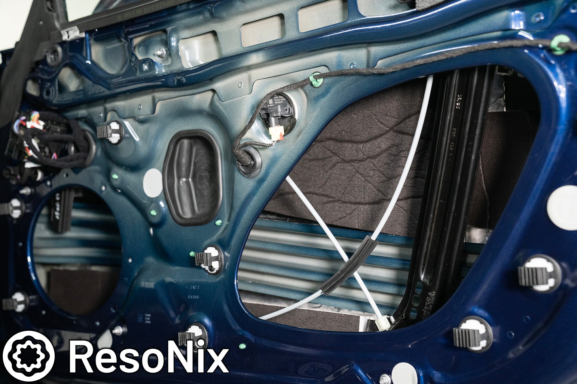 ResoNix Sound Solutions Guardian hydrophobic melamine and MLV door midbass rear wave sound absorber installed into the door of a Porsche 911 to reduce distortion from the audio system and reduce outside wind and tire noise
