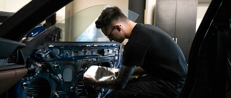 Nick installing ResoNix CLD Squares Sound Deadening Material Into the door of a Porsche 911