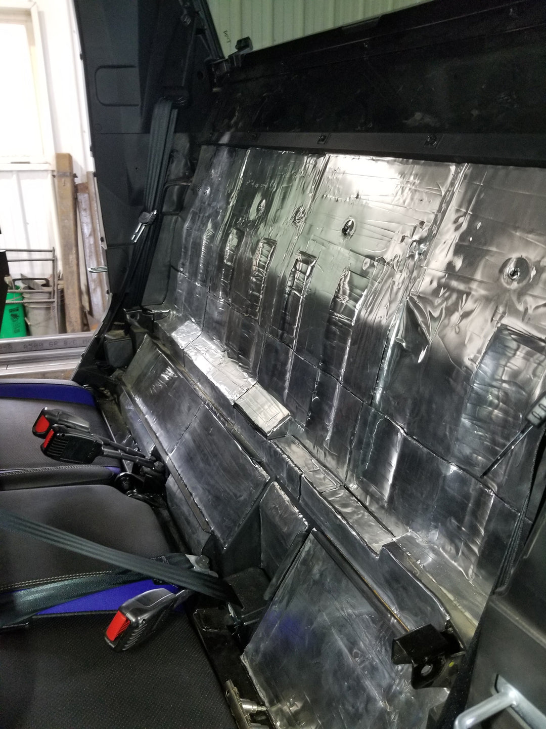 ResoNix Sound Solutions Mega CLD Squares Sound deadening material installed onto the interior firewall of a Polaris Xpedition to reduce sound from the engine
