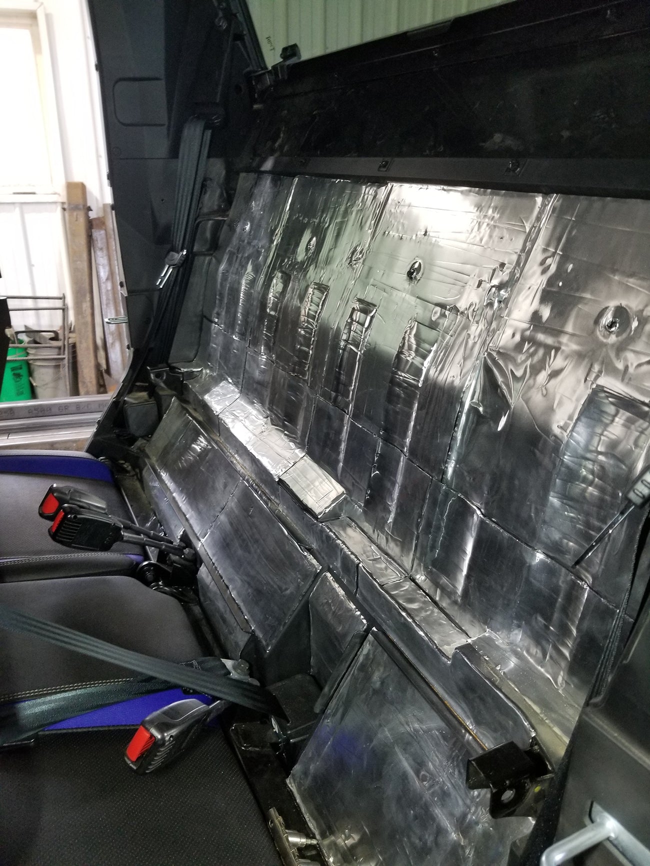 ResoNix Sound Solutions Mega CLD Squares Sound deadening material installed onto the interior firewall of a Polaris Xpedition to reduce sound from the engine
