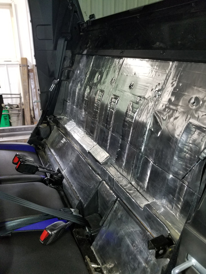 ResoNix Sound Solutions Mega CLD Squares Sound deadening material installed onto the interior firewall of a Polaris Xpedition to reduce sound from the engine