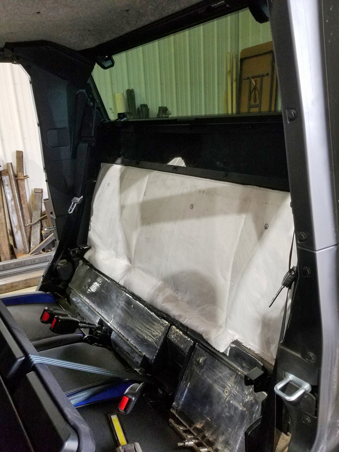 ResoNix Sound Solutions Fiber Mat Sound deadening and sound absorbing material installed onto the interior firewall of a Polaris Xpedition to reduce sound from the engine