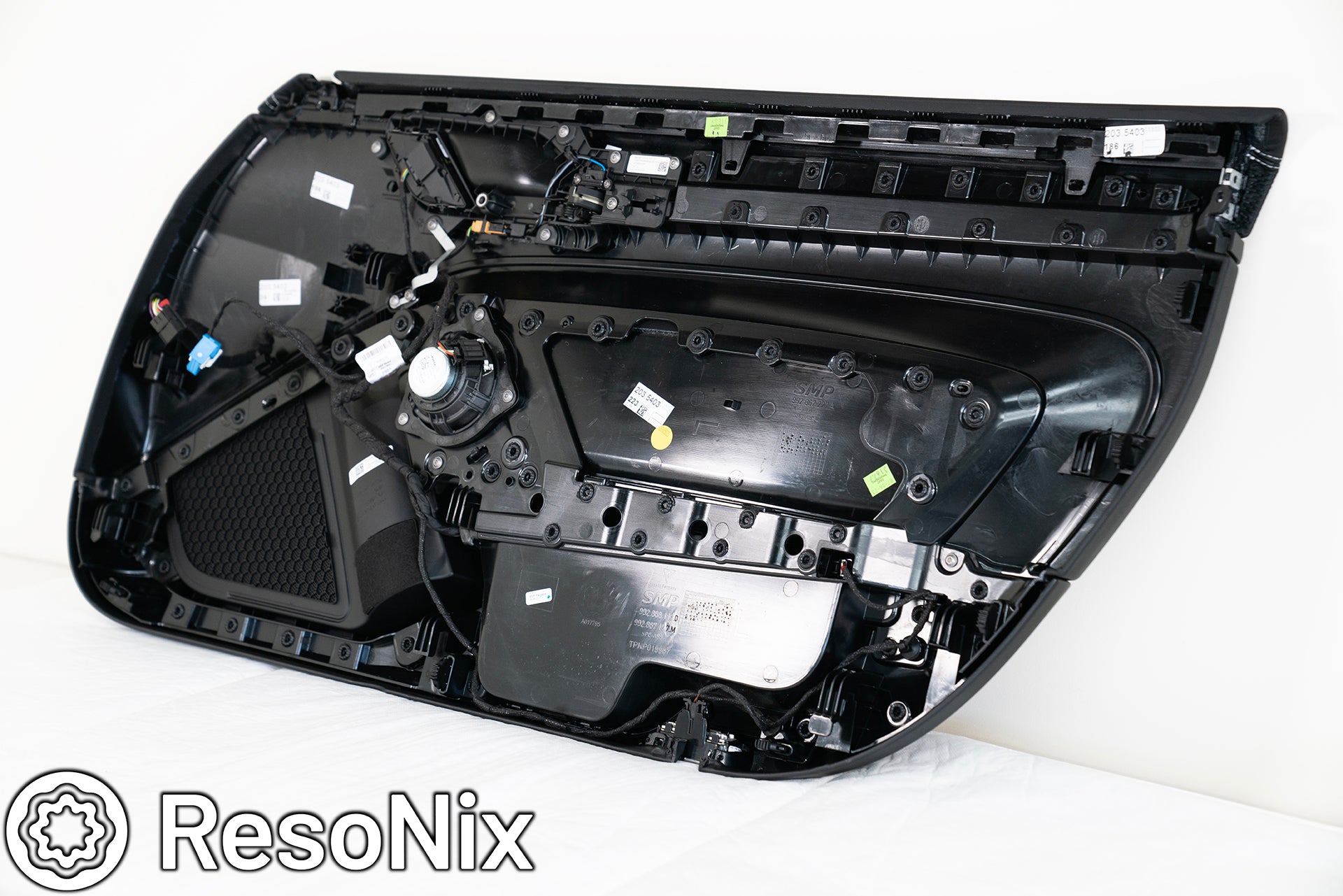 Back side of a Porsche 992 911 GT3 Touring door panel being prepared for ResoNix Sound Solutions sound deadening products