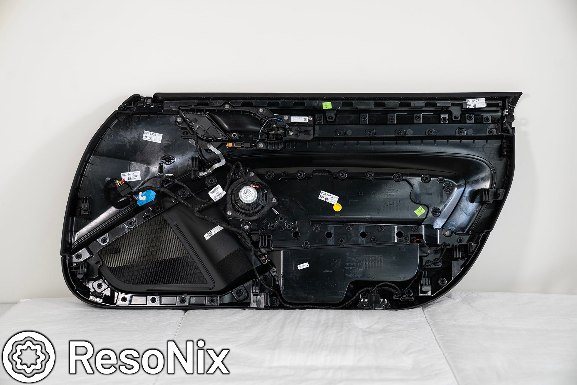 Back side of a Porsche 992 911 GT3 Touring door panel being prepared for ResoNix Sound Solutions sound deadening products