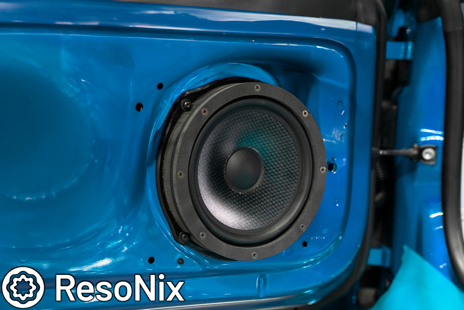 ResoNix Sound Solutions Fast Rings Speaker Foam Ring installed around a car door mounted midbass speaker for better midbass performance