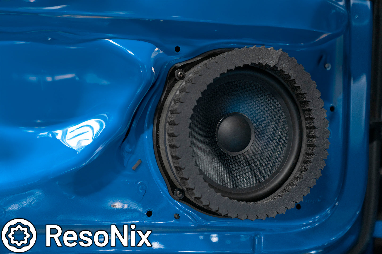 ResoNix Sound Solutions Fast Rings Speaker Foam Ring installed around a car door mounted midbass speaker for better midbass performance