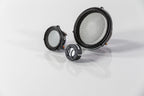 3-way set of Automotive Accuton Ceramic tweeter, midrange, and midbass car audio speakers with white color cones displayed on a reflective surface