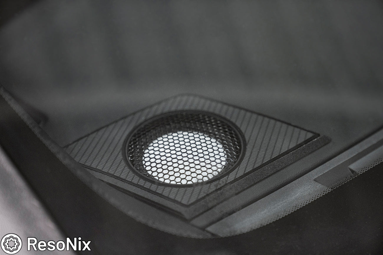 close up of an Accuton Automotive C100AM 3.5" midrange speaker installed into the dash corner of a car